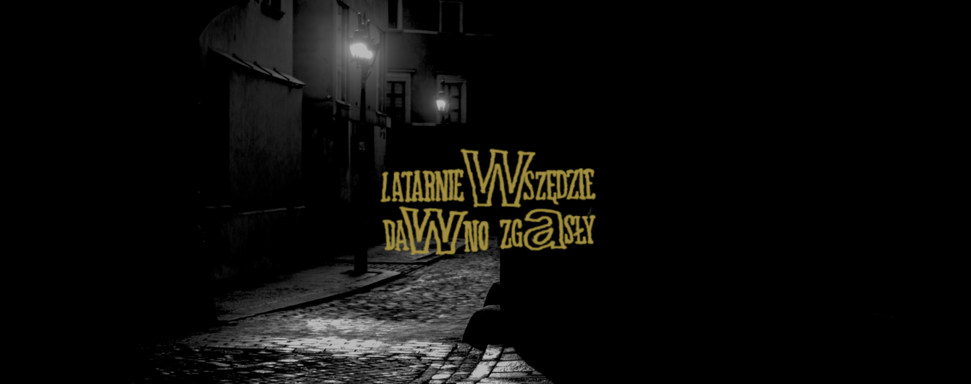 Napisz "Latarnie Wszędzie Dawno Zgasły" z nowej płyty Taco Hemingwaya na tle ciemnej, szaro-czarnej ulicy w nocy i latarni.