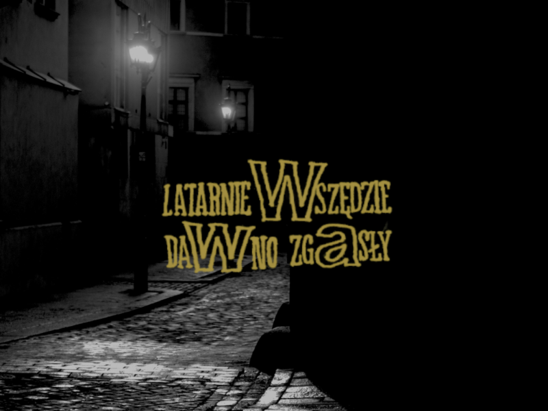 Napisz "Latarnie Wszędzie Dawno Zgasły" z nowej płyty Taco Hemingwaya na tle ciemnej, szaro-czarnej ulicy w nocy i latarni.